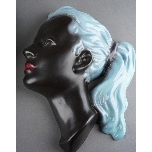 61 - A German Cortendorf wall plaque of a female in side profile with pony tail, impressed no.3408, print... 