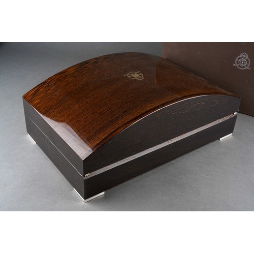 16 - A boxed Girard-Perregaux Haute Horologie domed rosewood finish automatic watch winder cabinet, hinge... 