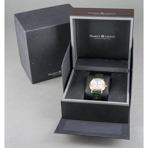 21 - A Maurice Lacroix 'Jumping Hour' yellow metal and stainless steel manual winding wristwatch. The dia... 