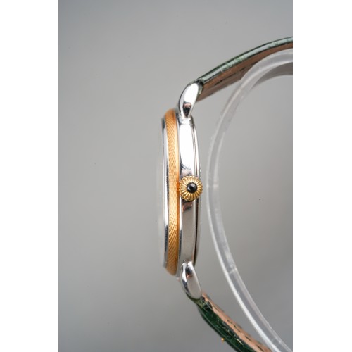 21 - A Maurice Lacroix 'Jumping Hour' yellow metal and stainless steel manual winding wristwatch. The dia... 
