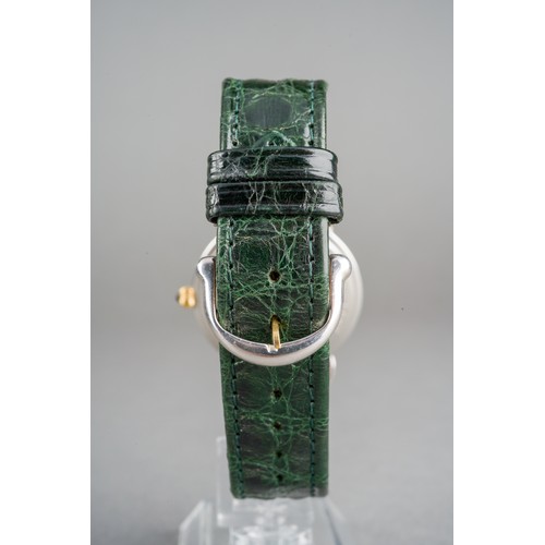 21 - A Maurice Lacroix 'Jumping Hour' yellow metal and stainless steel manual winding wristwatch. The dia... 