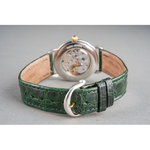 21 - A Maurice Lacroix 'Jumping Hour' yellow metal and stainless steel manual winding wristwatch. The dia... 