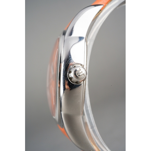 26 - A Maurice Lacroix 'Sphere' stainless steel quartz wristwatch. The orange dial 'Maurice Lacroix swiss... 