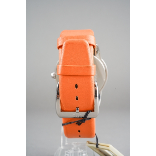 26 - A Maurice Lacroix 'Sphere' stainless steel quartz wristwatch. The orange dial 'Maurice Lacroix swiss... 
