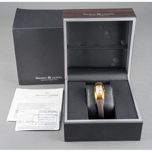 37 - A boxed Maurice Lacroix ladies gold plated and stainless steel wrist watch on a brown rubber bangle ... 