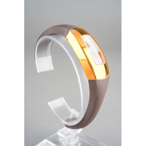 37 - A boxed Maurice Lacroix ladies gold plated and stainless steel wrist watch on a brown rubber bangle ... 