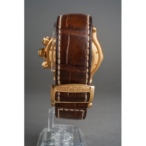 51 - An Ebel '1911' 18ct yellow gold automatic chronograph wristwatch.  The circular-shaped dial with lum... 