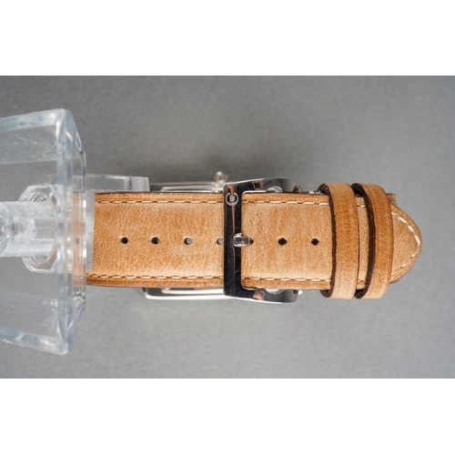 84 - A CHRISTOPHER WARD quartz wristwatch. The rectangular-shape dial with Arabic numerals, subsidiary di... 