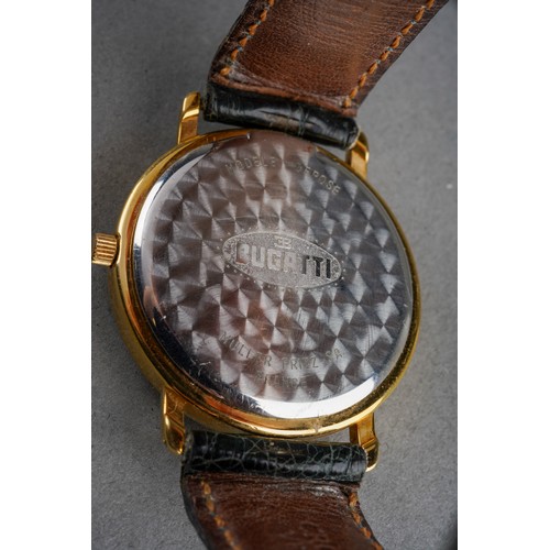 7 - A Bugatti chronograph quartz wristwatch. The dark blue dial with white Arabic numerals, moon phase a... 