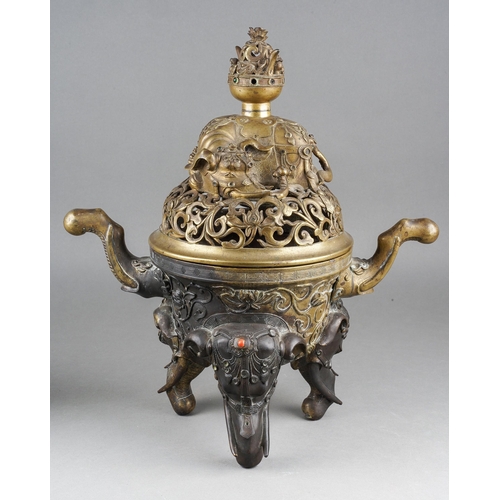 A 19th century Chineese gilt bronze and inlaid censer, the domed and pierced cover cast with a recumbent elephant with twin handled censer on its back, the base cast with elephant trunk handles and on three elephant head legs, some remnants of semi-precious stones / paste mounts, gilding worn, approx height 39cm (1)