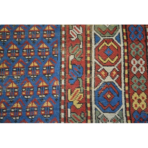 13 - A large colourful hand knotted rug runner - approximately 9ft 6