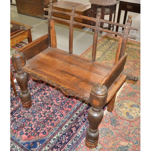 19 - A 19th century Indian hardwood throne chair with carved decoration