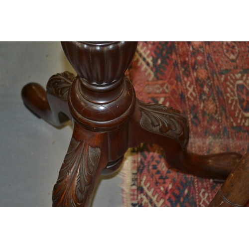 39 - A vintage carved wooden pedestal with a glass top
