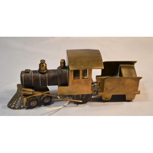 425 - A rare and unusual early 20th century brass and Bakelite model train with carriage. Probably WW2 per... 