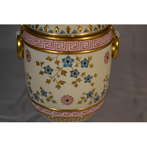 391 - An unusual hand painted Minton covered vase with pierced cover -1873-1912 mark - approx 8