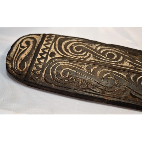 402 - An unusual antique carved wooden tool possibly Maori or South Sea Islands. The handle carved with wa... 