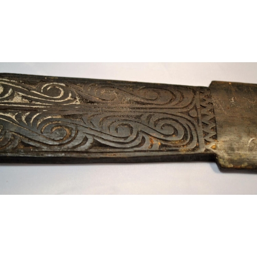 402 - An unusual antique carved wooden tool possibly Maori or South Sea Islands. The handle carved with wa... 