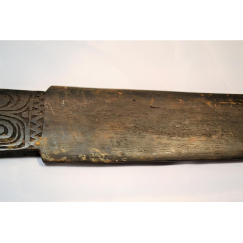 402 - An unusual antique carved wooden tool possibly Maori or South Sea Islands. The handle carved with wa... 