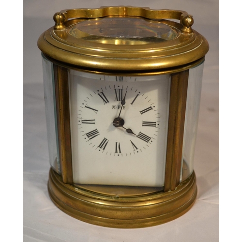 240 - A Victorian oval carriage clock in original leather case