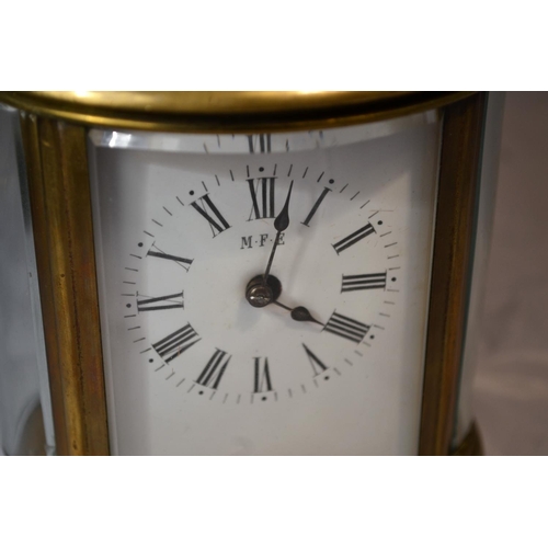 240 - A Victorian oval carriage clock in original leather case