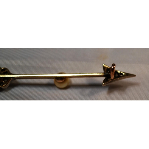 348 - A yellow metal, diamond and seed pearl brooch formed as an arrow. Approx 2