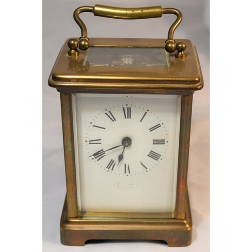 243 - A vintage brass cased mechanical carriage clock