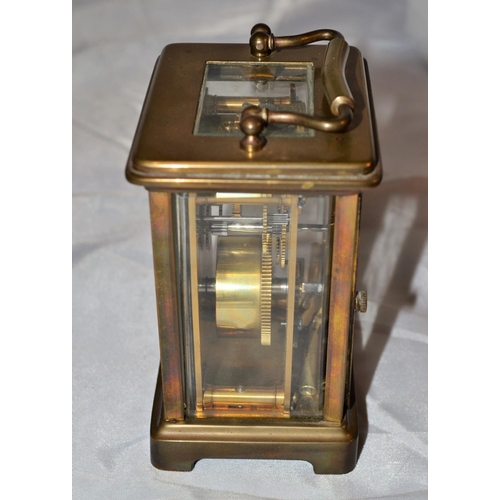 243 - A vintage brass cased mechanical carriage clock