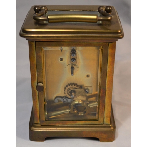 243 - A vintage brass cased mechanical carriage clock