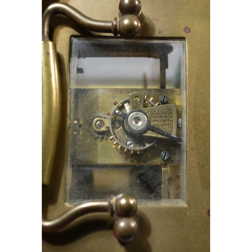 243 - A vintage brass cased mechanical carriage clock