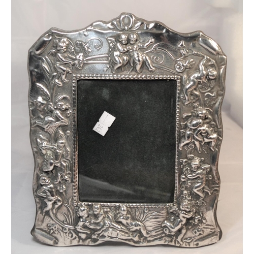 359 - A silver photograph frame decorated with cherubs - Birmingham 1997 by Ray Hall - approx 9