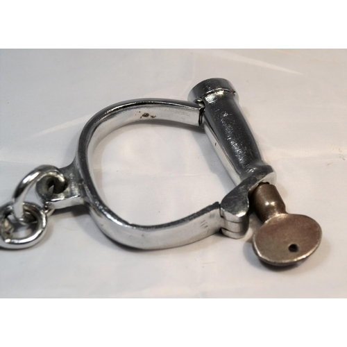 110 - A pair of vintage Hiatt hand cuffs with key