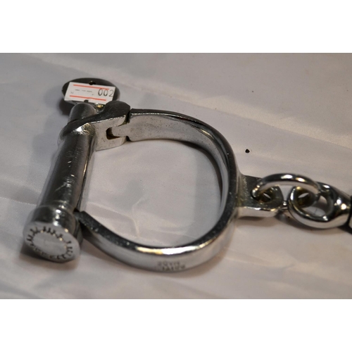 110 - A pair of vintage Hiatt hand cuffs with key