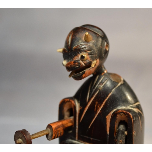 374 - A Meiji period (1868-1912) wooden articulated Kobe toy modeled as a drummer