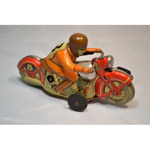 379 - A 1960's Japanese tin plate wind up toy motorcycle by TN