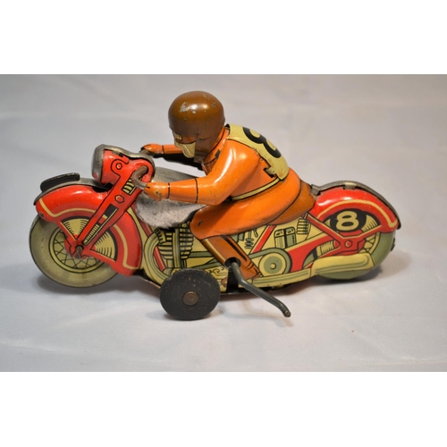 379 - A 1960's Japanese tin plate wind up toy motorcycle by TN