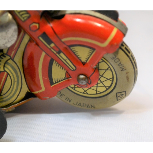 379 - A 1960's Japanese tin plate wind up toy motorcycle by TN