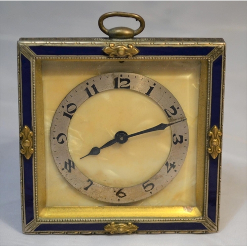 382 - An early 20th century bedside easel clock with enamel decoration