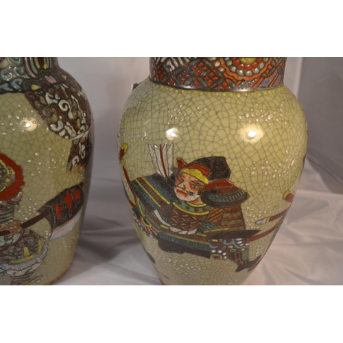 413 - Two enamelled crackle glaze vases, Meiji/ Taisho period. Each painted with Samurai warriors with red... 