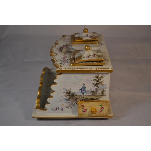 421 - An antique Delft or Faience desk stand with hand painted scenes. Likely 19th century. Marked verso