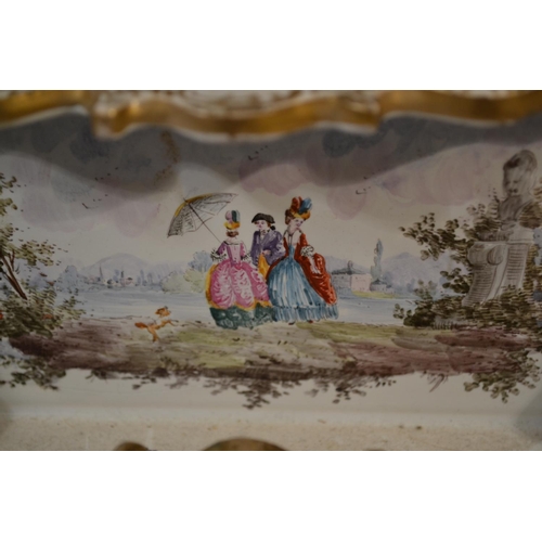 421 - An antique Delft or Faience desk stand with hand painted scenes. Likely 19th century. Marked verso