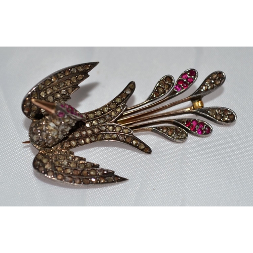 358 - A 19th Century gold, diamond and ruby set brooch in the form of a bird - 1.75