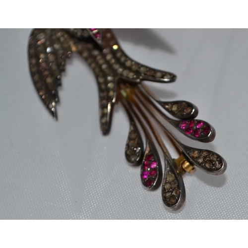 358 - A 19th Century gold, diamond and ruby set brooch in the form of a bird - 1.75