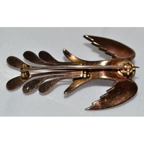 358 - A 19th Century gold, diamond and ruby set brooch in the form of a bird - 1.75