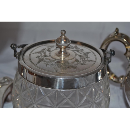 428 - An antique silver plated Samovar, a silver plate and cut glass biscuit barrel and a silver plated te... 