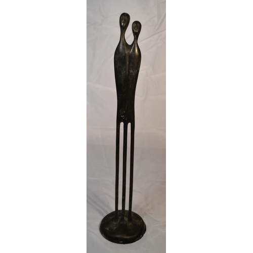 530 - A bronze sculpture of 2 tall thin figures impressed verso 