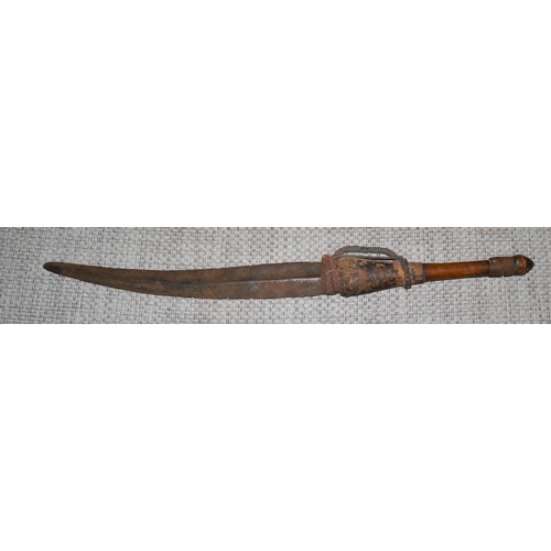 116 - An usual ethnic sword with fur decoration - probably 19th century and likely African