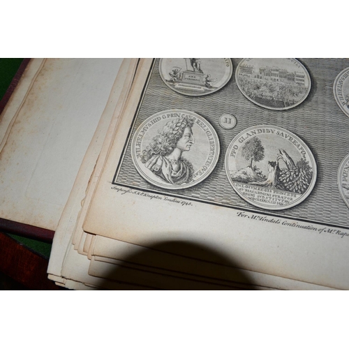 257 - A 17th century leather book cover from a book on Cambridge University and containing pages of medals... 