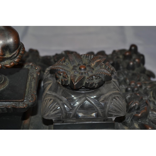 445 - An antique bronze desk stand mounted with classical figures - approx 17