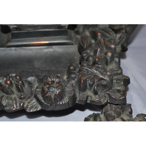 445 - An antique bronze desk stand mounted with classical figures - approx 17