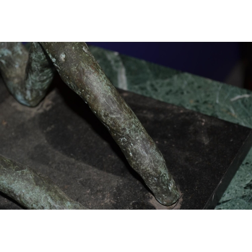 529 - A large abstract bronze sculpture on a marble plinth with green patination - total height including ... 